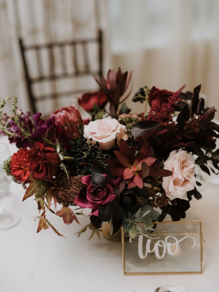 Blush and burgundy floral centerpiece for your moody wedding