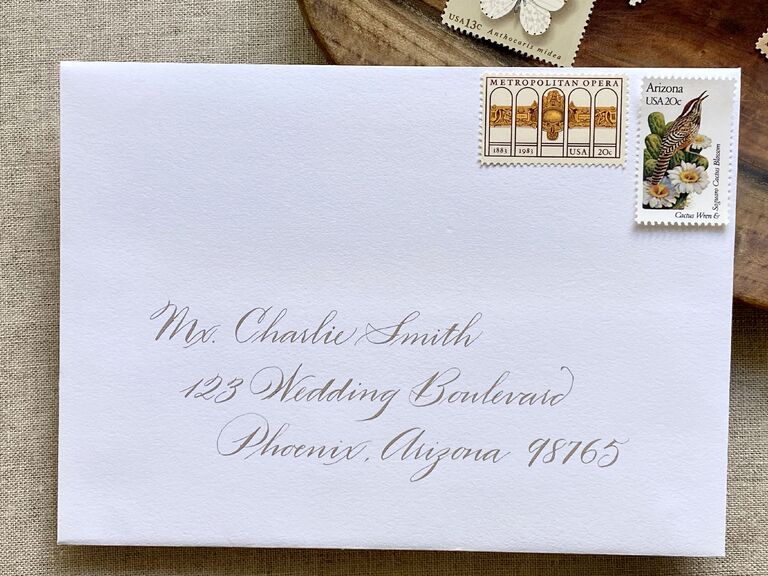 White envelope with elegant calligraphy name and address