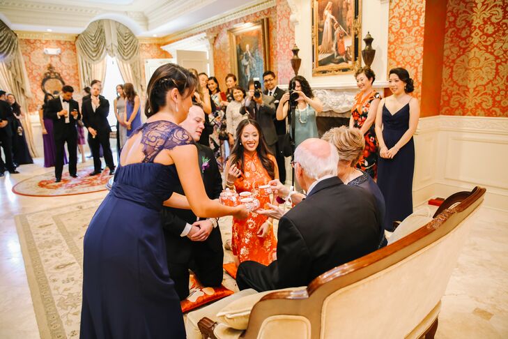 To honor Anne's Chinese heritage, the couple's family and bridal party took part in a traditional Chinese tea ceremony before the wedding. Elders are honored with tea served by the couple.