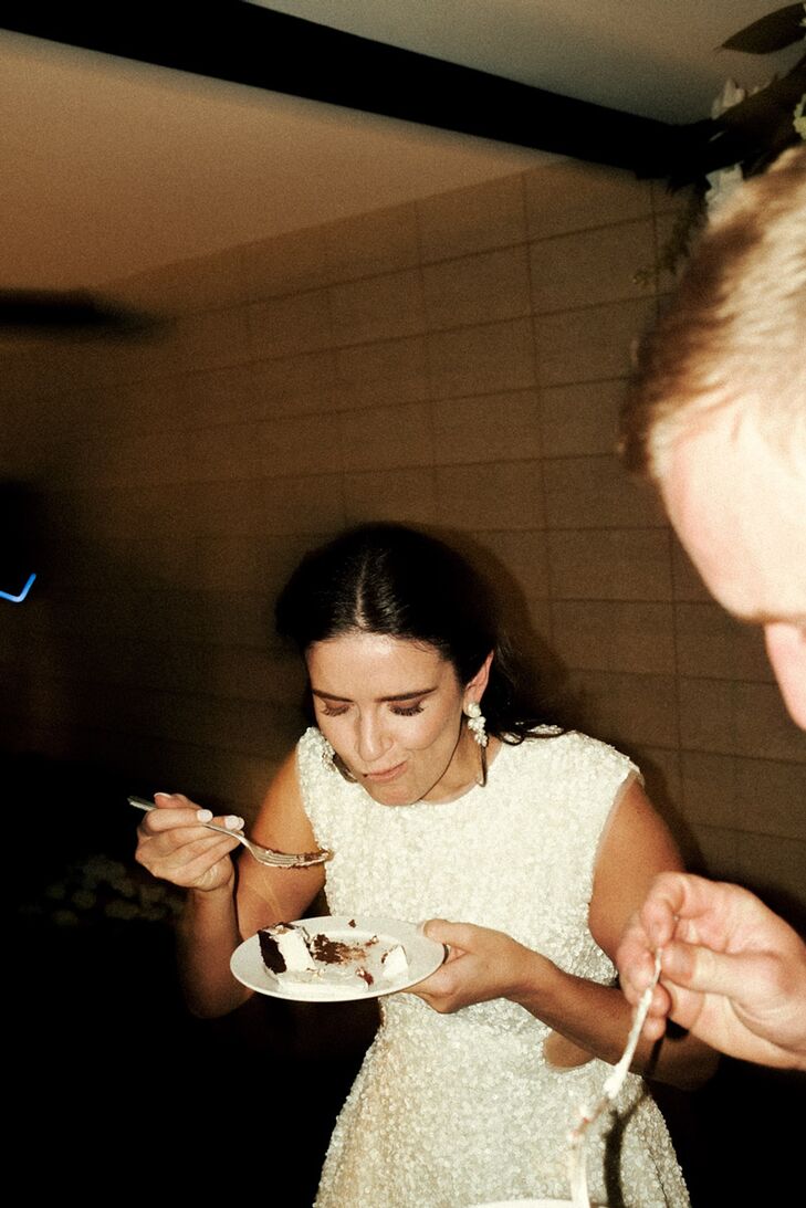Bride in After-Party Short Dress Enjoying a Piece of Cake
