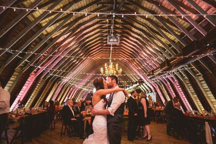 With such an ornate barn as their backdrop, Ashley and Eric had to let it shine. Only string lighting from Omnivent Event Services was draped along the ceiling. Low birch-wood-inspired candles were also placed along the tables.