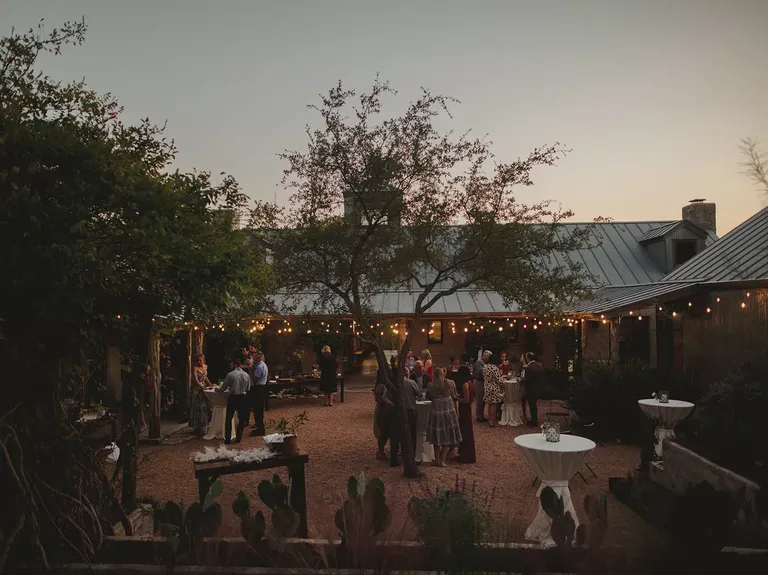 Outdoor reception space at dusk at Cactus Moon Lodge wedding venue in Austin, Texas