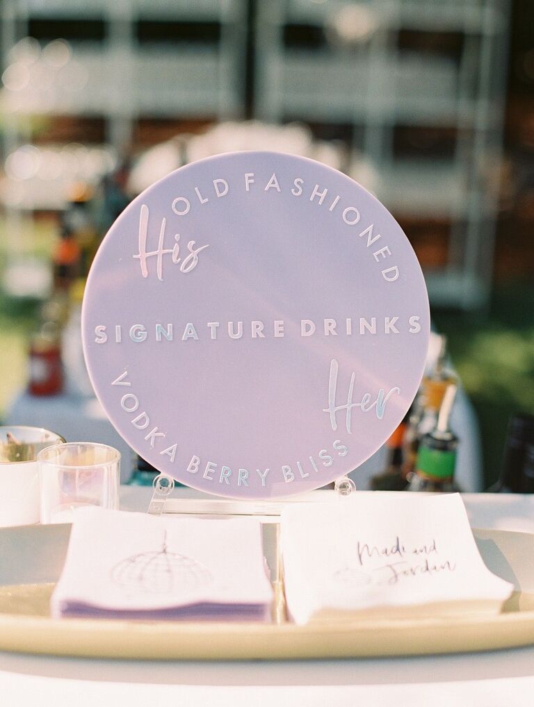 Round purple signature cocktail menu sign