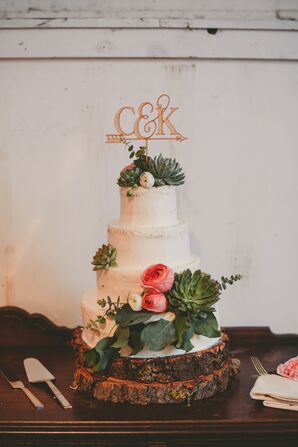 Wedding Cake With Succulents and Gold Topper