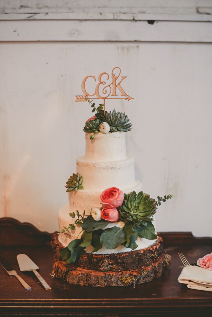 "Our cake was a partially naked olive oil, rosemary and citrus cake with lemon curd, baked by the amazing and talented co-owner of Sand Rock Farm, Jen Hagglof," Crystal says. "It was topped by a laser-cut wooden topper gifted by one of my bridesmaids."