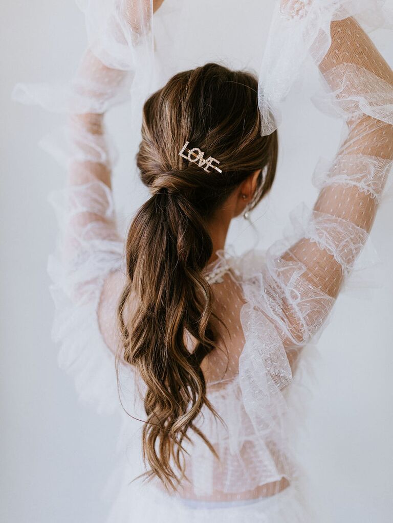 Model wears a hairpin that reads "Love."