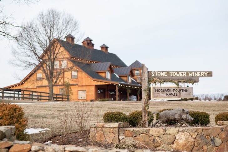 Stone Tower Winery has a rustic, log cabin vibe with hand-painted signs and stone landscaping.