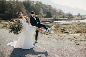 Bride and Groom Showing Off Their Unique Blue Wedding Shoes