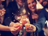 people holding sparklers
