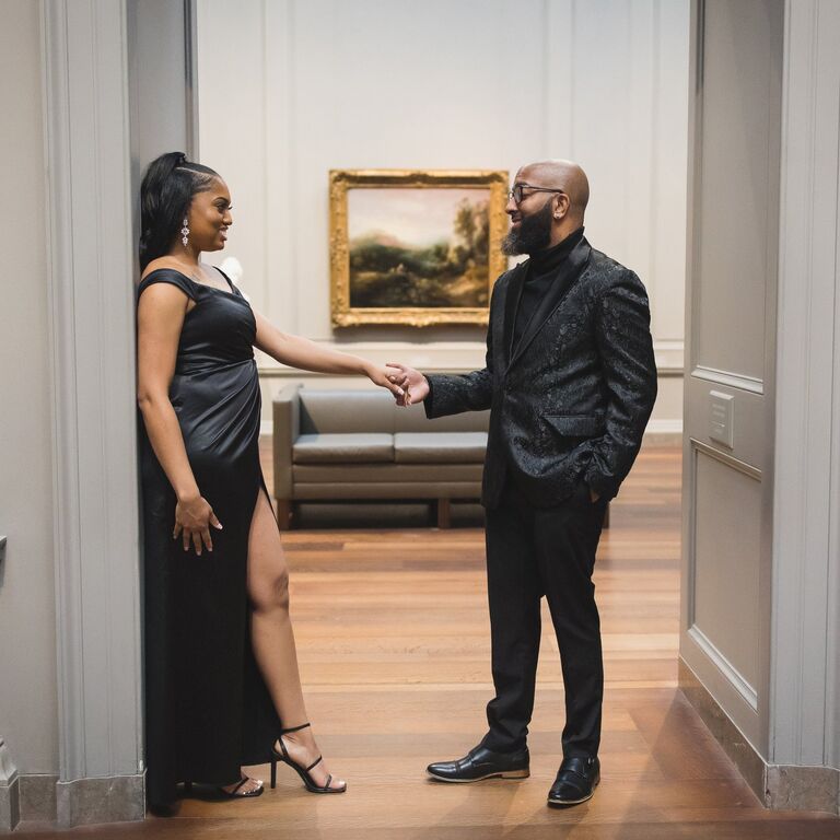 Couple holding hands inside Washington, DC museum