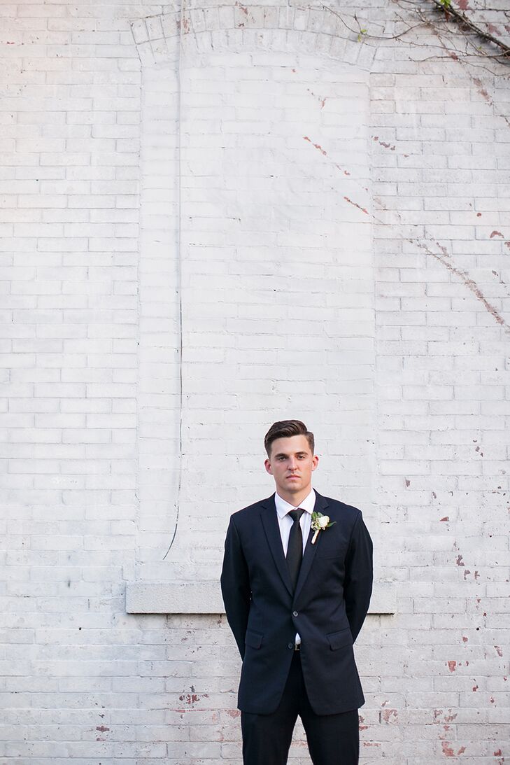 Tanner knew that the formality of a tux wasn’t the look he would feel comfortable in on his big day. Instead he chose a fitted navy suite from Jos. A. Bank for himself and his groomsmen that could easily be worn again.