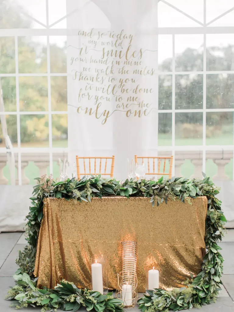 Gold Sequin Sweetheart Table with Lush Green Garland