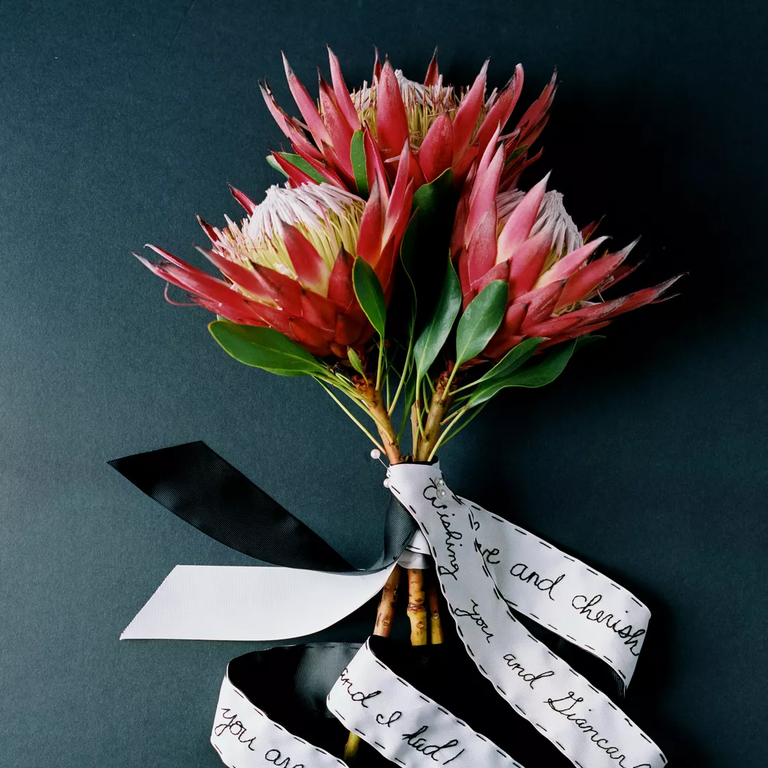 Dramatic protea bouquet with ribbons