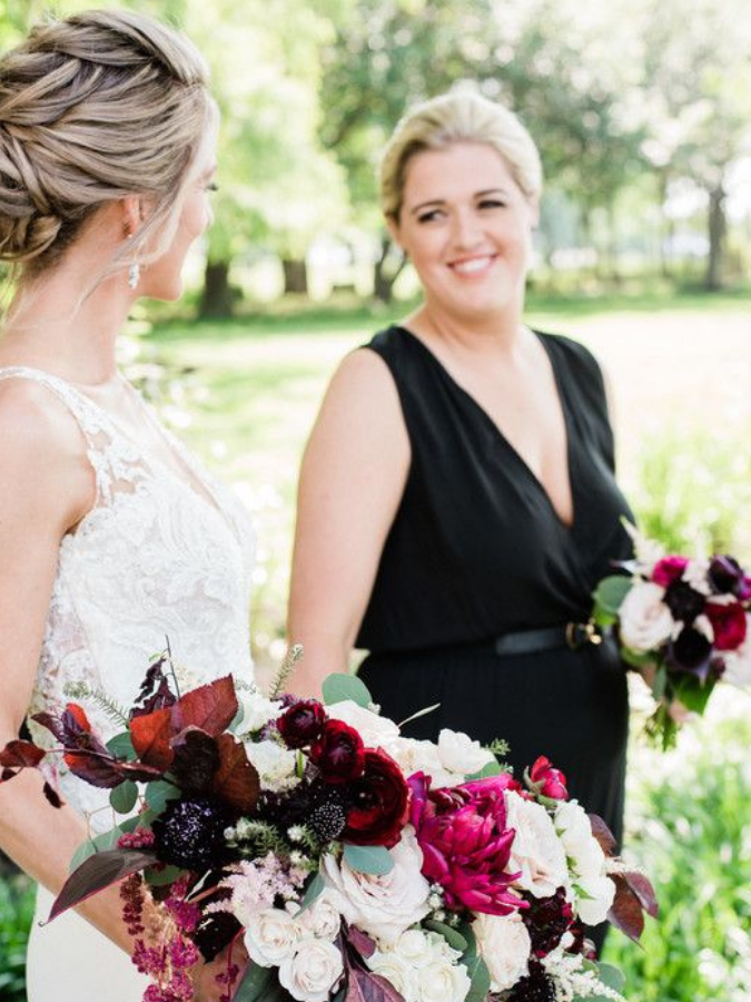 Two brides holding bouquets