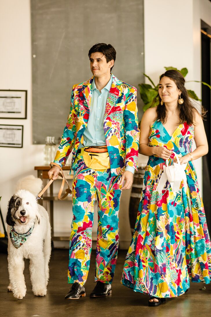 Wedding Attendants in Colorful Attire Escorting Dog