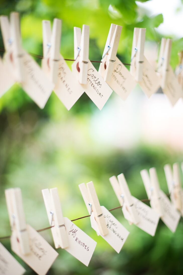 Danielle used materials from thrift stores to make the guests' name cards, which were hung from twine with a clothespin at the reception at Rancho Soquel in Aptos, California.