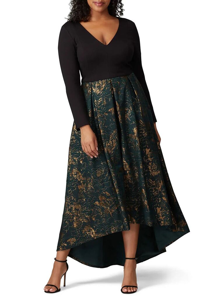 Plus-size mother-of-the-bride dress with black bodice, long sleeves and green-and-gold jacquard skirt