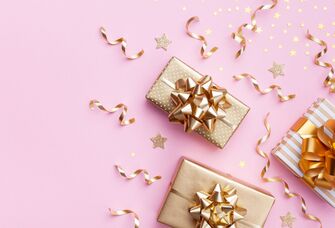 Gold presents on a pink background