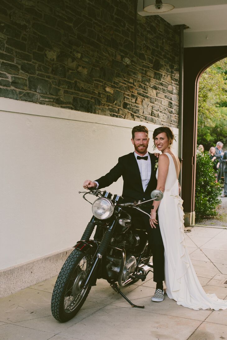 Tyler and Erin made a grand entrance to cocktail hour on the back of a 1969 Triumph Bonneville. After their portrait session, the newlyweds hopped on the back of the bike and rolled into the courtyard. “It was such a fun way to arrive at our reception,” Erin says.