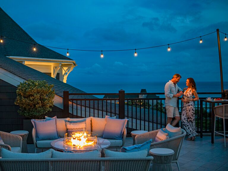 Man and woman at Henderson Beach Resort patio