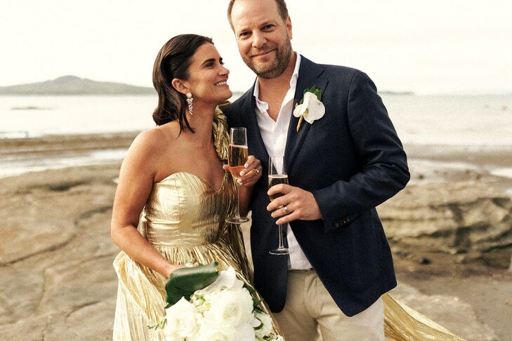 Bride in Gold Metallic Dress With Champagne and Groom in Casual Suit, Orchid Boutonniere