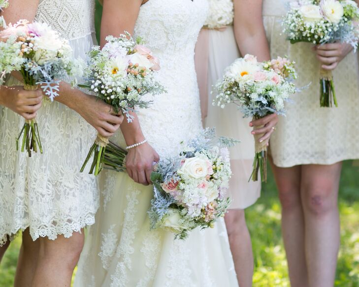 Kaylora let each of her bridesmaids wear a dress of their own choosing. The result: mismatched lace sheaths in shades of blush and ivory.