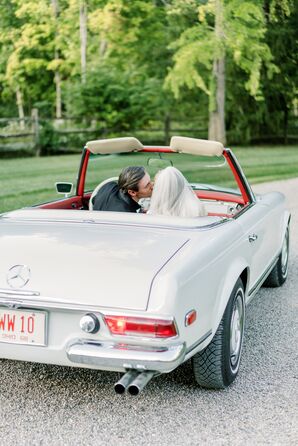 Bride and Groom Kiss in Classic 1968 Mercedes-Benz 280SL Getaway Car on Estate Driveway