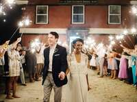 Bride and groom exiting wedding reception