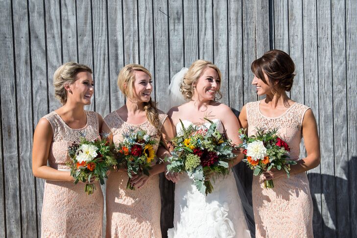 The bride's youngest sister wore this apricot lace gown for prom, and Lauren loved it so much that she had her other two bridesmaids buy the same one for the wedding attire.
