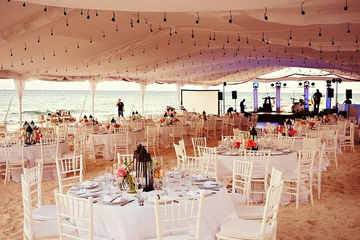 Marta and Jose Luis's reception took place under a tent illuminated by bistro lights and lanterns at Le Reve Hotel and Spa in Playa del Carmen, Mexico. “Everything was on the beach, so everyone took their shoes off and were comfortable. You could feel the ocean breeze,” Marta says.