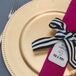 The fuchsia napkins, tied with black-and-white ribbons to channel Kate Spade, had individual thank-you notes to encourage each guest to sit back, relax and enjoy.