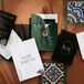 Timeless Black, White and Emerald Green Invitation Suit With Small Tropical Details