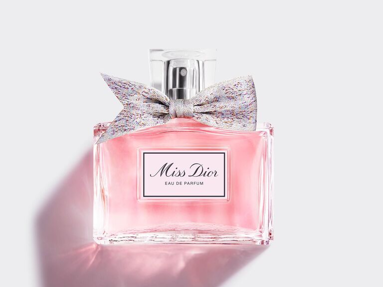 Bottle of Miss Dior perfume with a bow around the nozzle. 