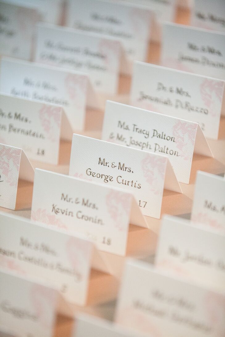 Lindsay and Mark had small escort cards displayed at the front table with pale pink designs in the corner.