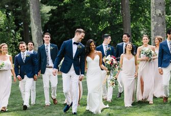 couple and wedding party walking together