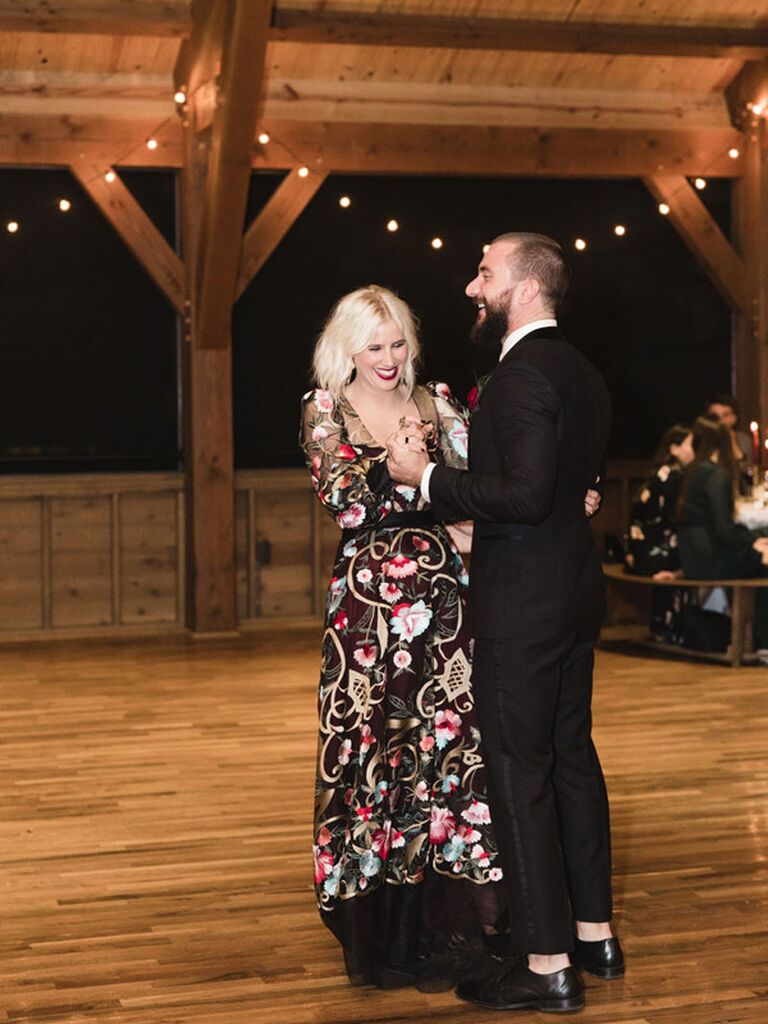 Edgy bride and groom dancing during first dance at wedding reception