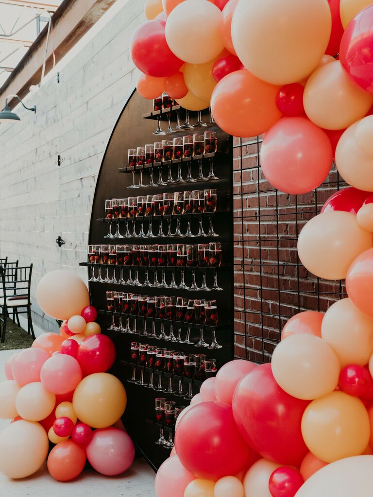 rainbow wedding ideas champagne welcome arch