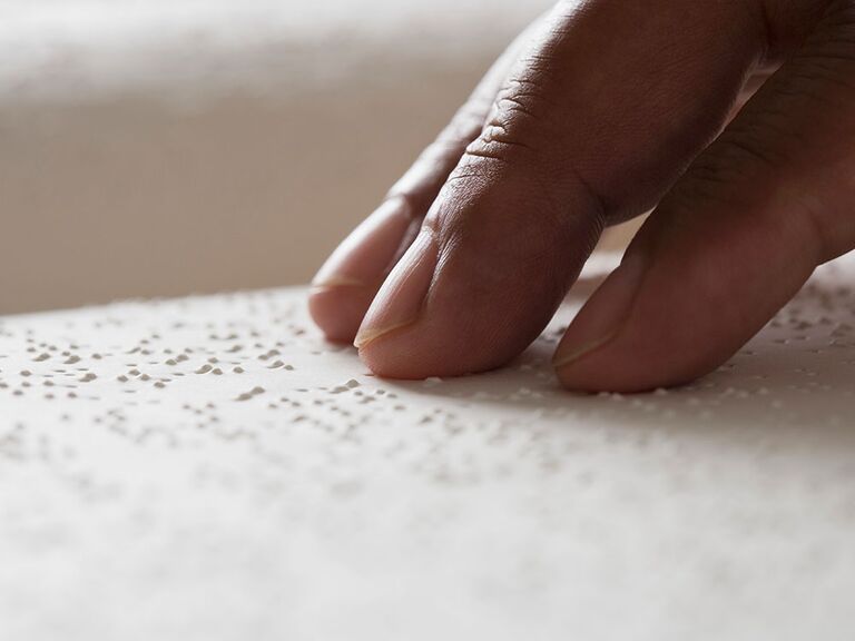 hand reading braille 