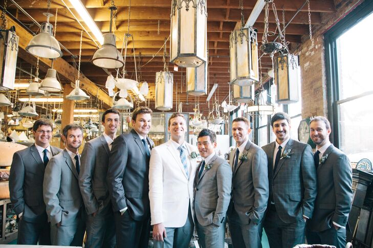 The groom wore white, which popped against his groomsmen in classic gray suits. "Rob wanted to wear white and I thought it was a great way to remind people that it's his day, too," Sarah says. "Plus, it took some of the focus off of me!"