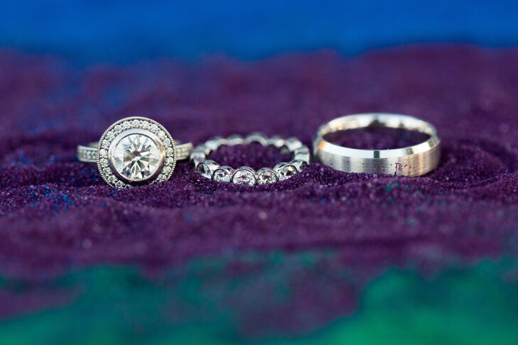 Eric proposed with a gorgeous, halo-set diamond ring. Jennifer chose an eternity-style wedding band, while Eric's band was a simple brushed style.
