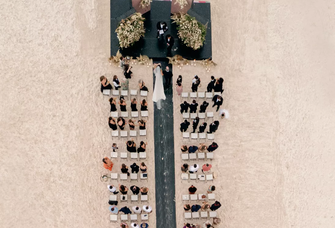 A happy couple ties the knot on the beach at Nizuc Resort and Spa in Mexico.