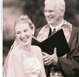 Colby and Roger said I do in a grassy area to the side of a pavilion walkway that sat at one end of a small lake. Because it was August and sunny, and to set the feel of a garden tea party, we offered each female guest a white paper parasol tied with a ribbon in our theme colors, says Colby.  Before the couple read vows they had written for each other, Colby’s younger sister sang Pie Jesu from Requiem. After the ceremony the guests were encouraged to explore the gardens, while the wedding party sat for pictures. A map was printed in the back of the wedding program to help guest find their way around the grounds.
