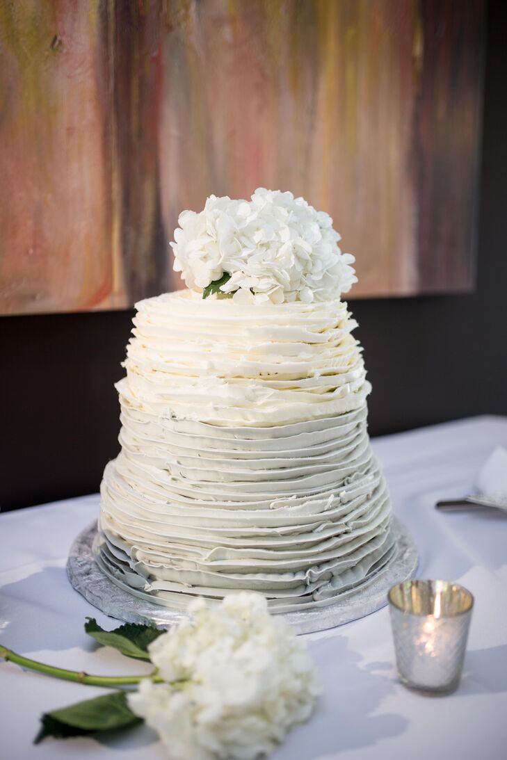 Snickerdoodles Bakery of Hampstead, Maryland, designed Mandy and Jesse's wedding cake, which had a white ombre design and cannoli flavor. "The most beautiful, straight-off-a-wedding-magazine-cover, decadent and delicious cake ever," Mandy says.