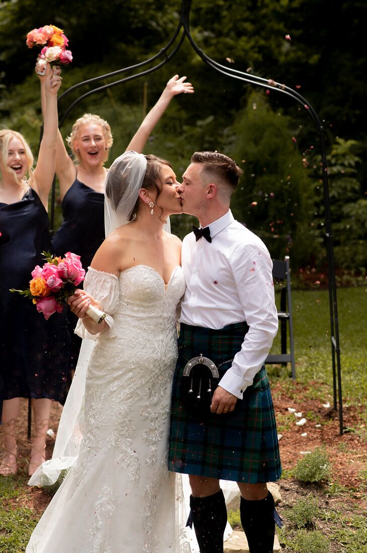 Bride With Veil Kissing Groom With Kilt