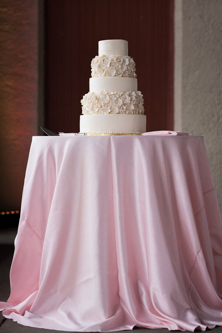 For dessert Kathleen and Alan enjoyed a five-tier white cake. Two tiers were decorated with handcrafted flowers on the buttercream frosting. Inside, the cake alternated between French vanilla and red velvet.