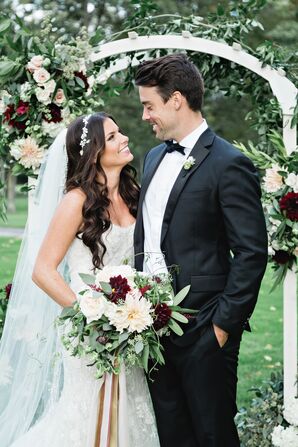 Classic Couple Under Wedding Arch at Point O'Woods Golf and Country Club in Benton Hills, Michigan