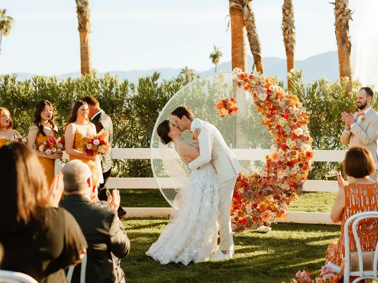 Circular Ceremony Arch With Vibrant Flowers