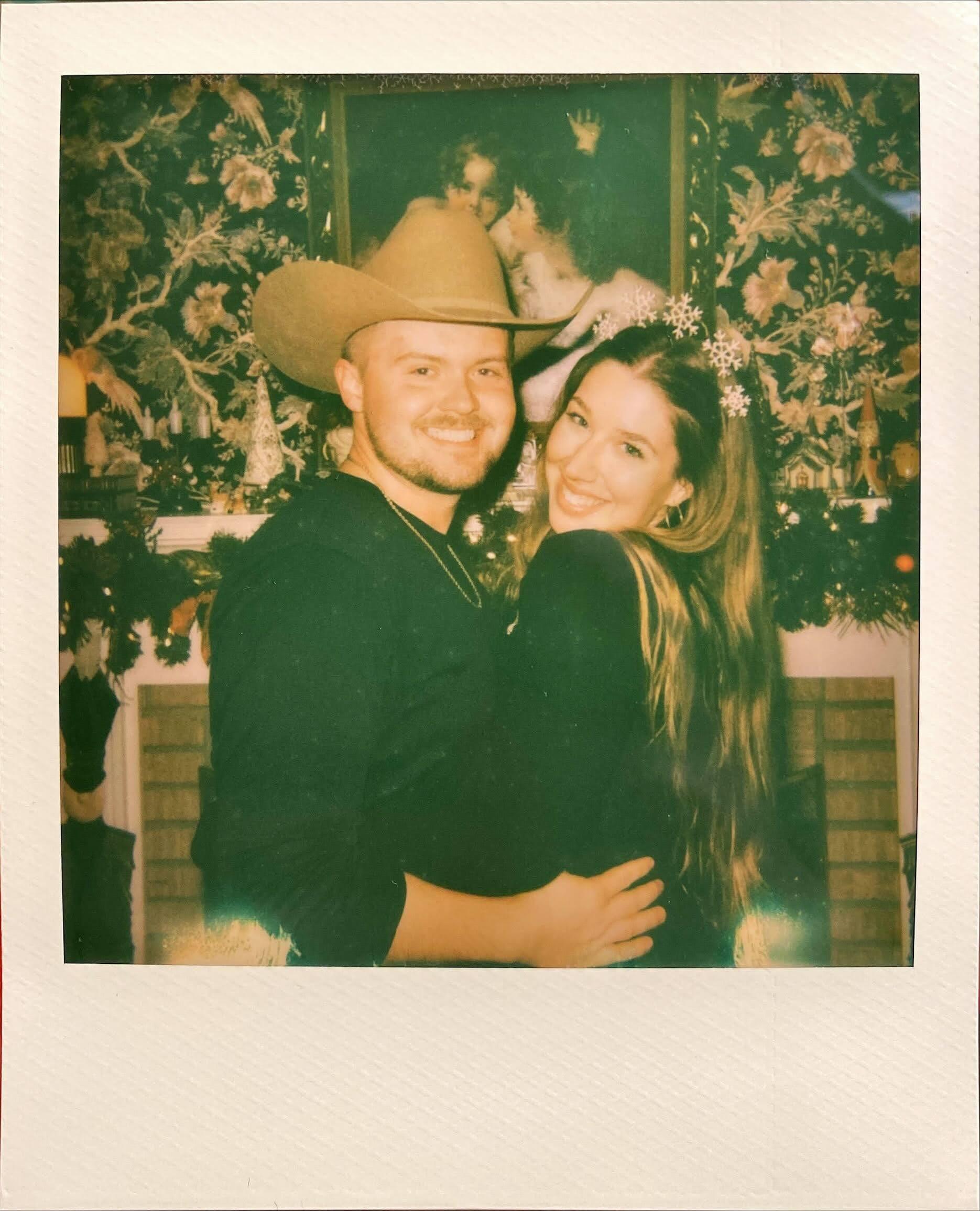 Ringing in the New Year with Jed's cowboy hat and a Polaroid