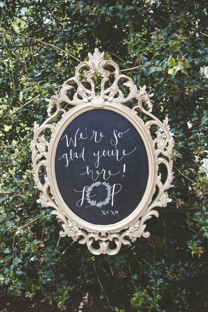 Lauren and her bridesmaids took care of all the signs, including this chic entrance piece. “We had so much fun drinking Moscow mules, listening to music and staying up late to finish the signs,” Lauren says. “Chalkboard markers were my best friend.” Using her love of vintage, they set the chalkboard note to guests inside a gold, oval frame.