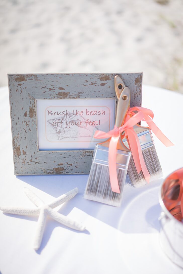 Of course, no beach wedding is complete without a few seashells. Starfish and conch shells were present in a few parts of their stationery, including a sweet sign for guests to dust the sand off their feet from the beach ceremony at at 'Tween Waters Inn Island Resort in Captiva Island, Florida.
